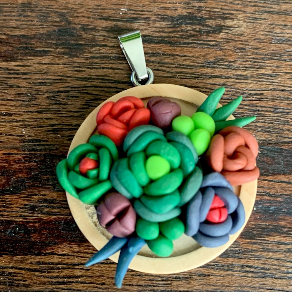 Handmade polymer clay pendant.